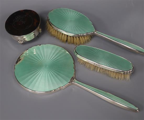 A silver mounted three piece dressing table set and silver and tortoiseshell trinket box.